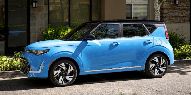 A light blue Kia Soul with a black roof.
